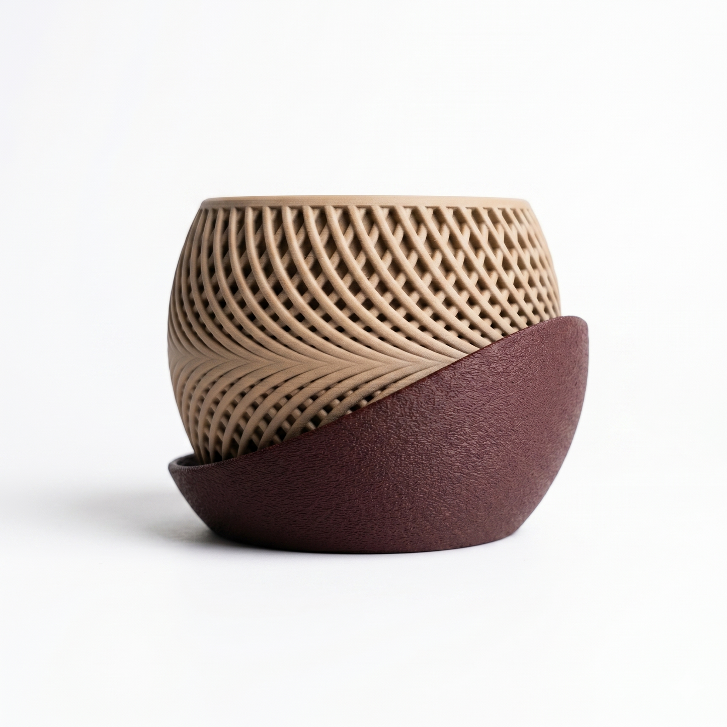 Two ceramic pots with textured surfaces on a white background