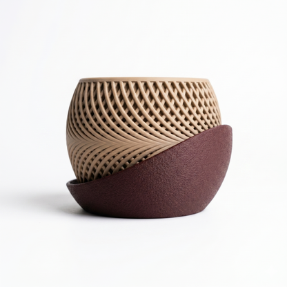 Two ceramic pots with textured surfaces on a white background