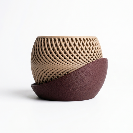 Two ceramic pots with textured surfaces on a white background