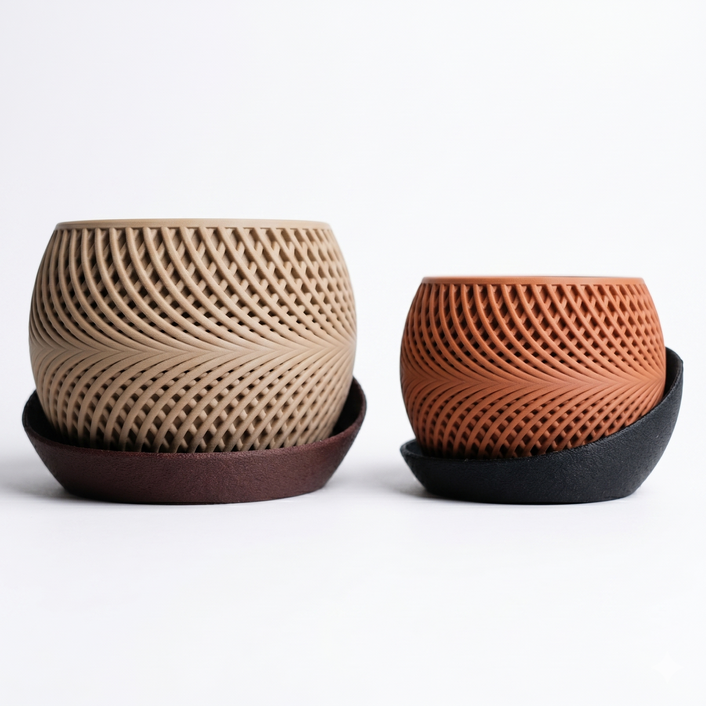 Two ceramic planters with textured surfaces on a white background