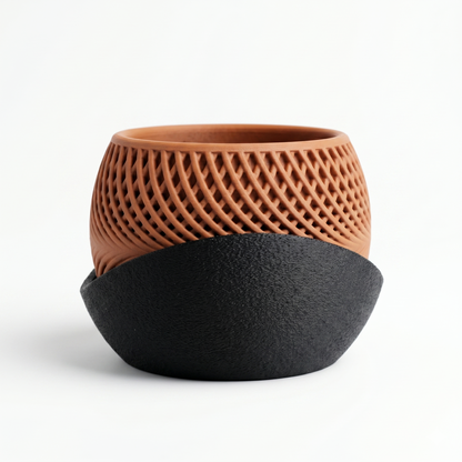 Ceramic planter with black base and textured brown top on a white background
