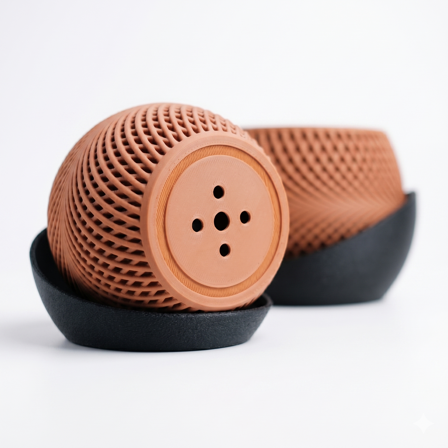 Brown textured object with black base on a white background