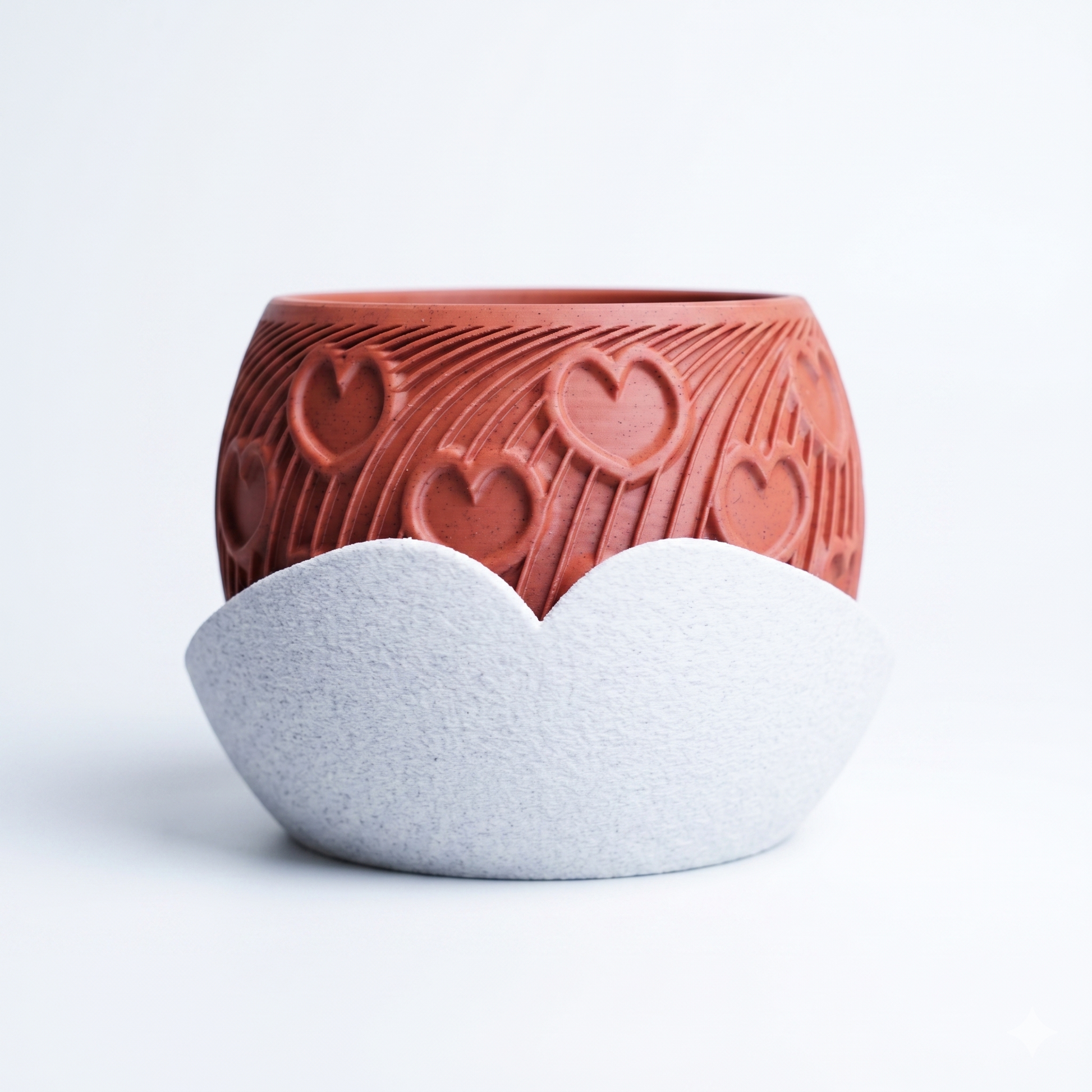 Heart Planter in terracotta with embossed heart and radiating arc pattern, paired with a sculptural white cloud-shaped drip tray — 3D printed indoor plant pot by Lux Print Labs