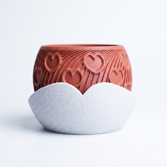 Heart Planter in terracotta with embossed heart and radiating arc pattern, paired with a sculptural white cloud-shaped drip tray — 3D printed indoor plant pot by Lux Print Labs