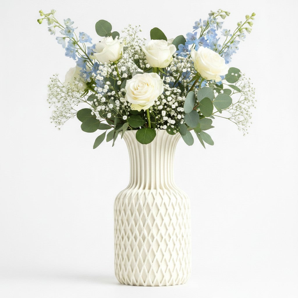 Juno Vase in white with diamond lattice pattern and fluted neck, styled with white roses, gypsophila and blue delphiniums — 3D printed decorative vase by Lux Print Labs