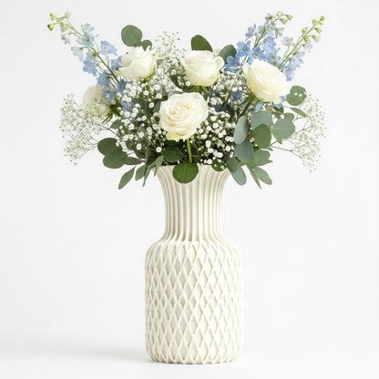 Juno Vase in white with diamond lattice pattern and fluted neck, styled with white roses, gypsophila and blue delphiniums — 3D printed decorative vase by Lux Print Labs