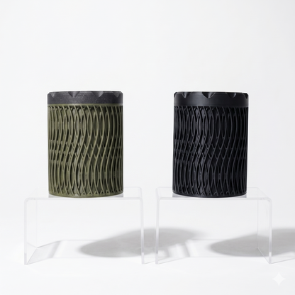 Ruck Container in olive green and black with open diamond wave lattice pattern and screw-top lid, displayed on clear acrylic risers — 3D printed everyday carry storage by Lux Print Labs