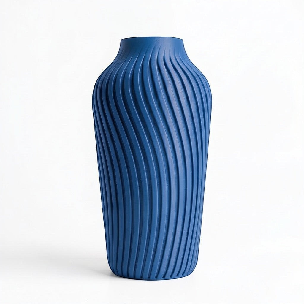 Lux Print Labs blue 3D printed vase with a radiating spiral pattern, available in two sizes.