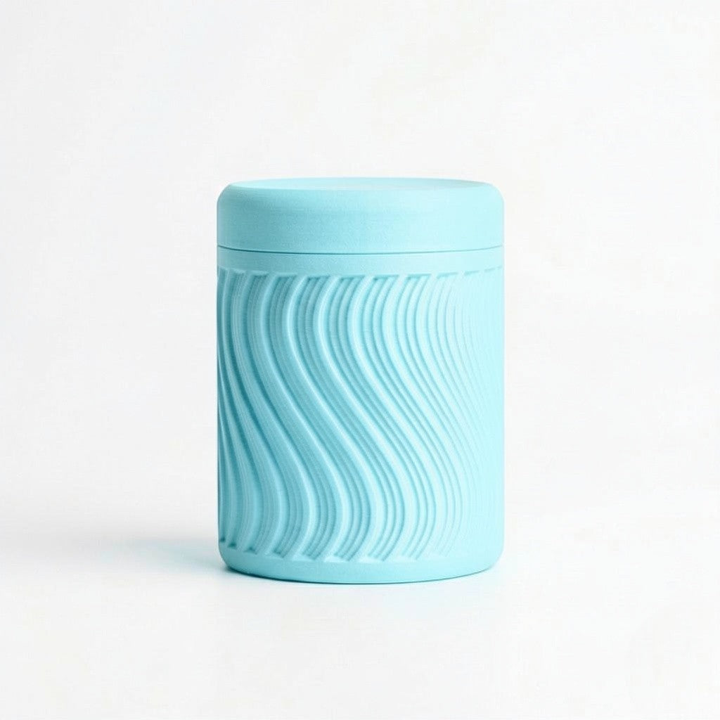 Lux Print Labs light blue PLA storage container with lid, featuring a textured wave pattern. Modern design, 74mm x 74mm x 96mm.