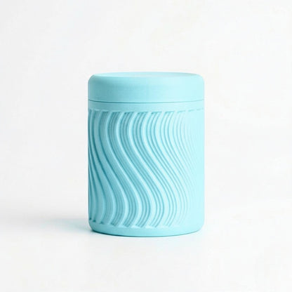 Lux Print Labs light blue PLA storage container with lid, featuring a textured wave pattern. Modern design, 74mm x 74mm x 96mm.