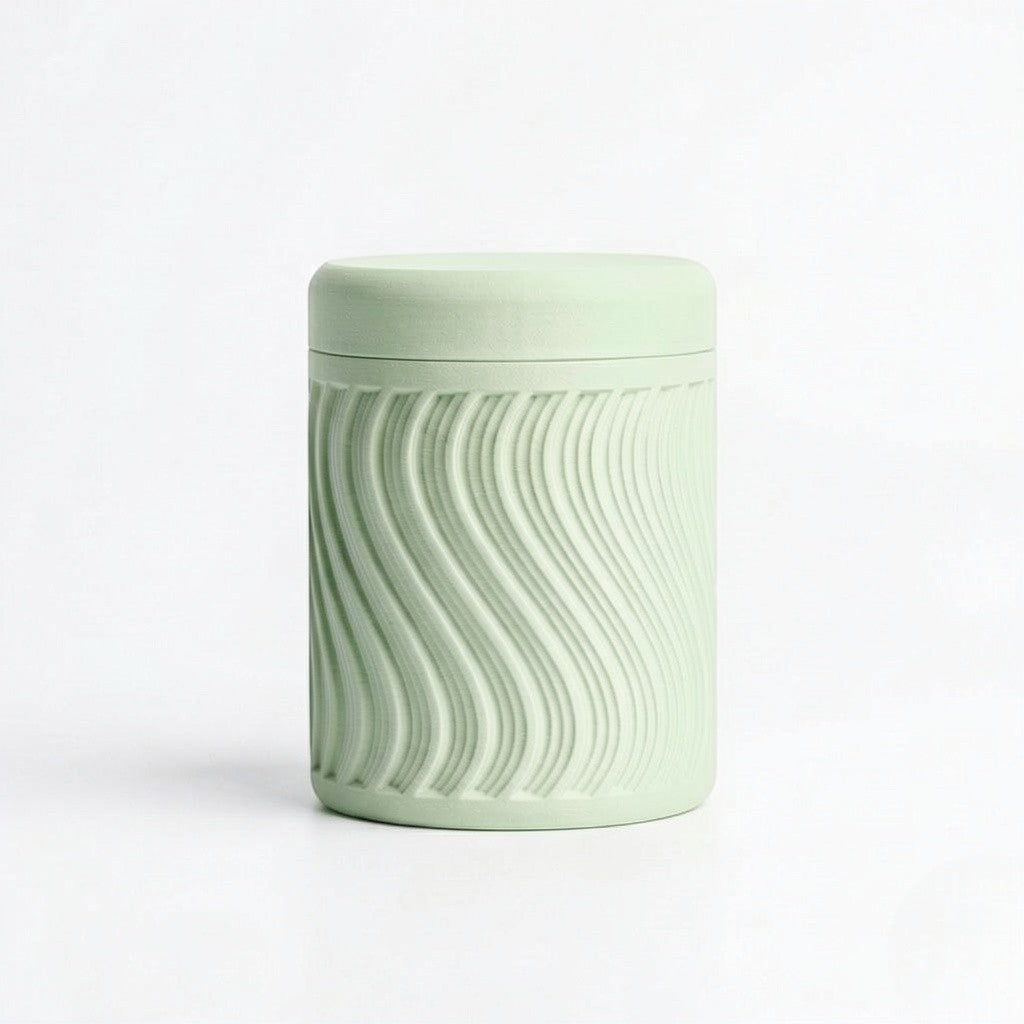 Lux Print Labs light green PLA storage container with lid, featuring a textured wave pattern. Modern design, 74mm x 74mm x 96mm.