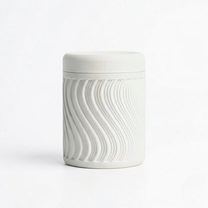 Lux Print Labs light grey PLA storage container with a textured wave pattern and lid.