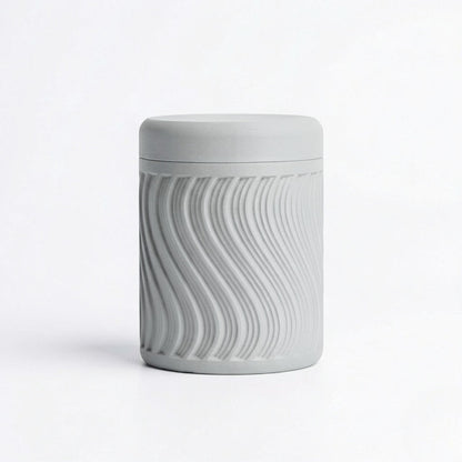 Lux Print Labs grey PLA storage container with a textured wave pattern and lid, perfect for trinkets.