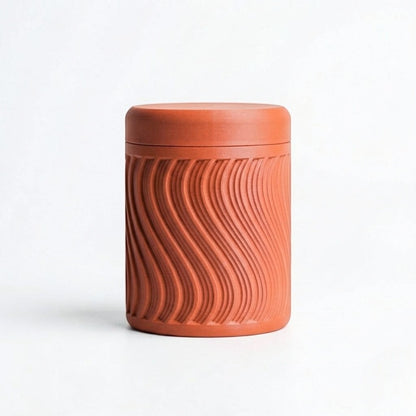 Lux Print Labs terracotta PLA storage container with a textured wave pattern and lid, perfect for small trinkets.
