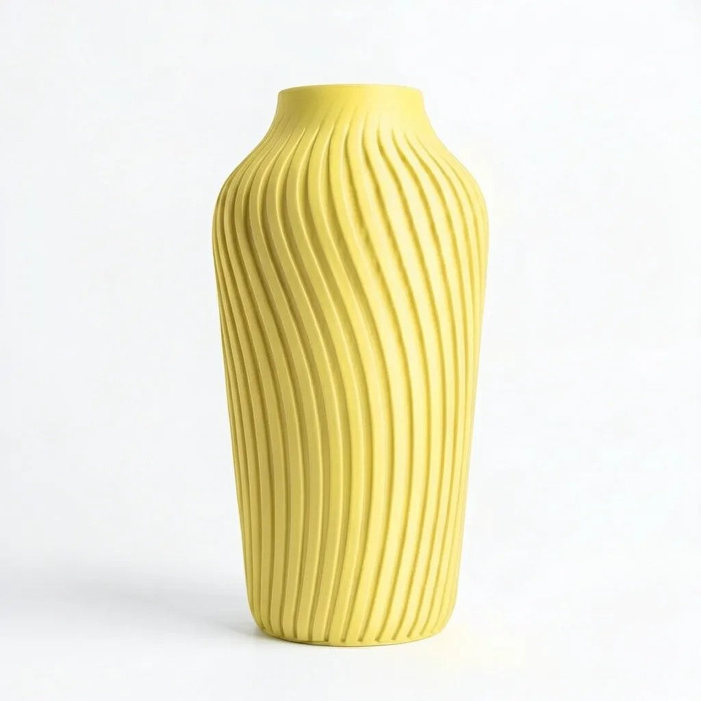 Lux Print Labs yellow 3D printed vase with a radiating spiral pattern, available in two sizes.