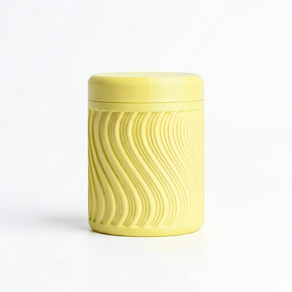 Lux Print Labs yellow PLA storage container with a textured wave pattern and lid, perfect for trinkets.