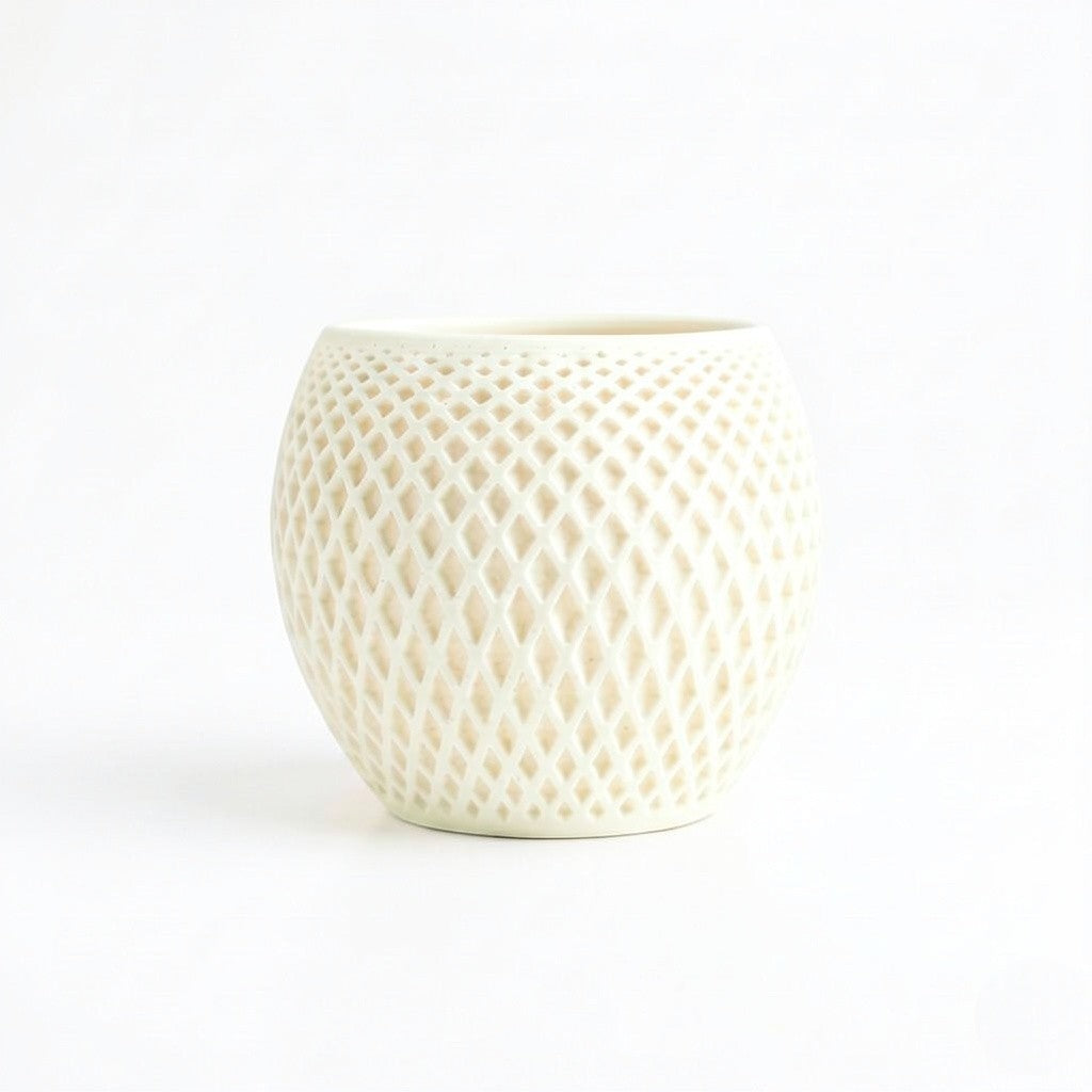 Lux Print Labs cream geometric diamond-weave planter with a matte finish and organic drip tray.