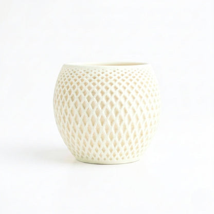 Lux Print Labs cream geometric diamond-weave planter with a matte finish and organic drip tray.