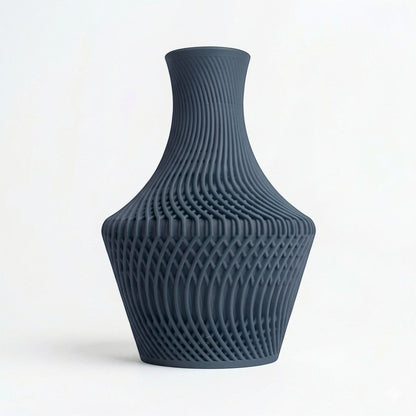Lux Print Labs dark grey 3D printed PLA vase with a unique layered, flowing design and visually striking texture.