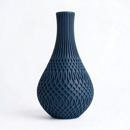 Lux Print Labs Inflect Vase in deep blue matte PLA, featuring vertical fluting that transitions to a geometric lattice pattern.