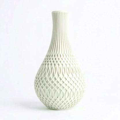 Lux Print Labs Inflect Vase in pale green, featuring a geometric transition from vertical fluting to a woven lattice pattern. Made from matte PLA.