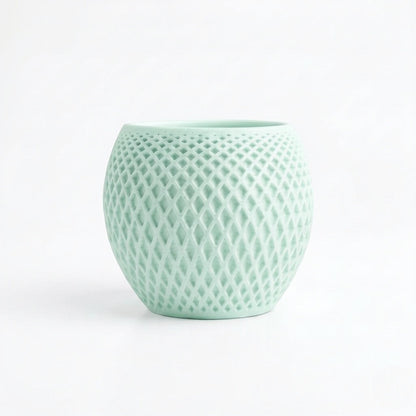 Lux Print Labs mint green geometric diamond-weave planter made from matte PLA with a solid drip tray.