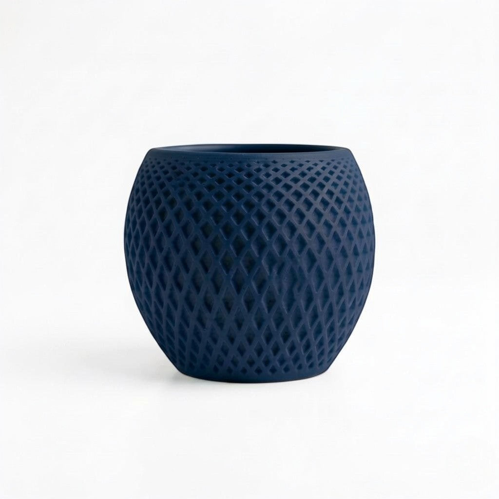 Lux Print Labs navy blue geometric diamond-weave planter made from matte PLA with a perforated shell.