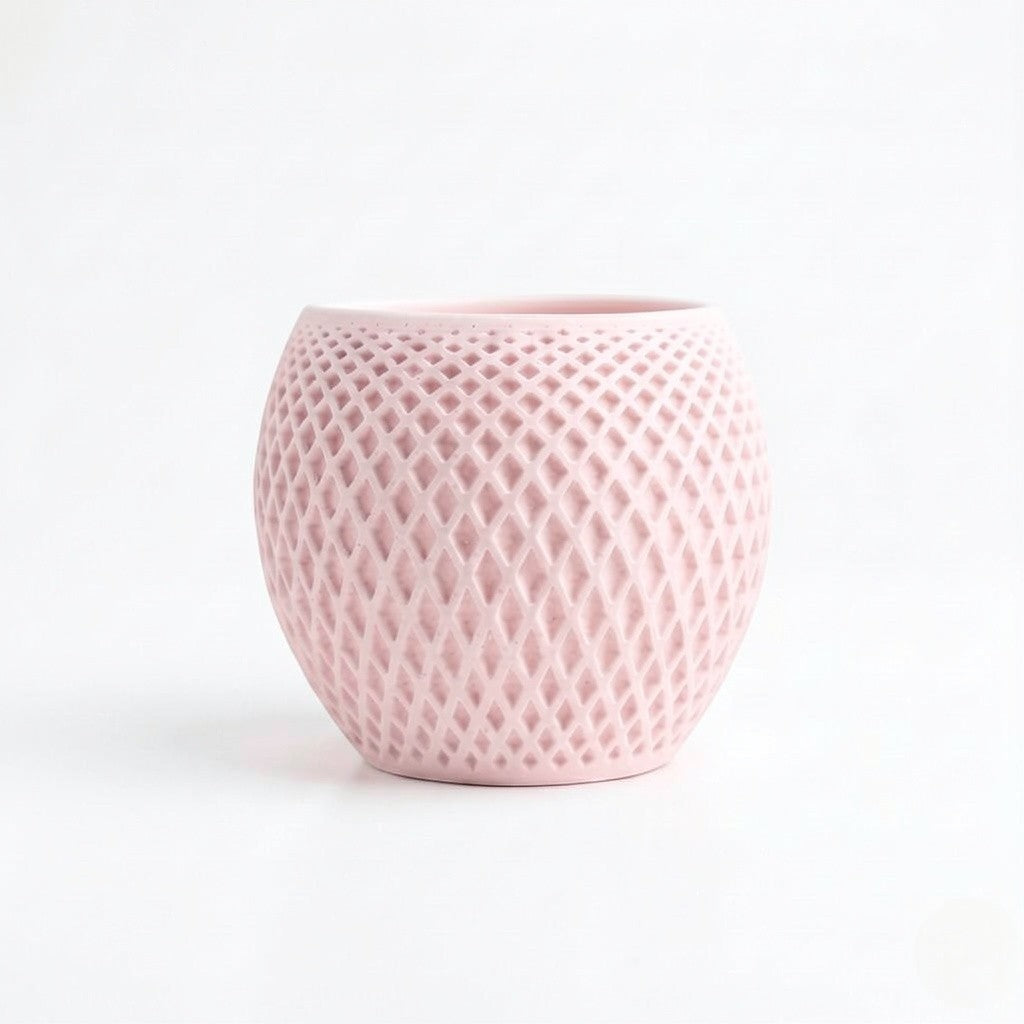 Lux Print Labs pink geometric diamond-weave planter with a matte finish and organic drip tray.