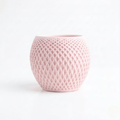 Lux Print Labs pink geometric diamond-weave planter with a matte finish and organic drip tray.
