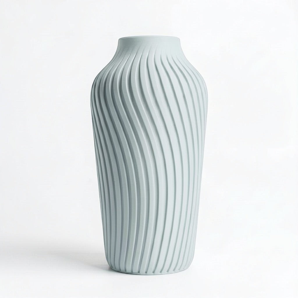 Lux Print Labs light blue 3D printed vase with a radiating spiral pattern, available in two sizes.