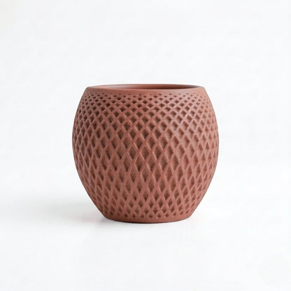 Lux Print Labs terracotta geometric diamond-weave planter with a matte finish.